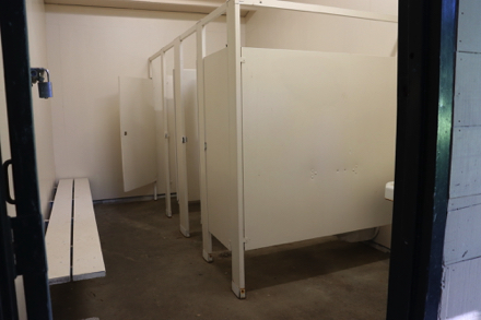 Inside the restrooms on the Willamette River side of park - accessible stall - bench - sink